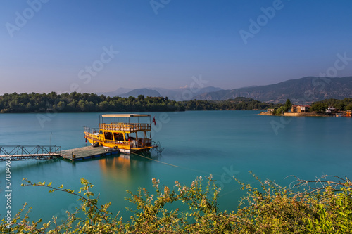Green Lake in Green Canyon with boat. Manavgat, Antalya, Turkey. Long exposure shot, july 2020