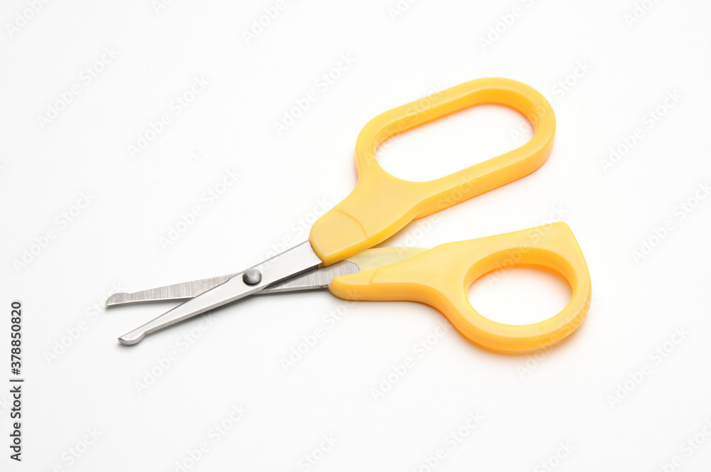 Yellow baby scissors on a white background Yellow baby scissors on a white background