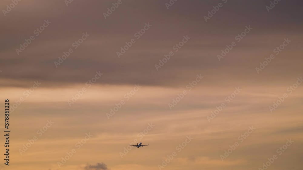 Aircraft is flying in sunset sky. Travel concept Aircraft is flying in sunset sky. Travel concept
