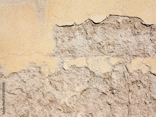 Abstract concrete, weathered with cracks and scratches. Remains of paint different colors on wall. Landscape style. Grunge Concrete Surface. Great background or texture.