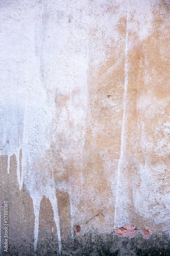 Abstract concrete, weathered with cracks and scratches. Remains of paint different colors on wall. Landscape style. Grunge Concrete Surface. Great background or texture.