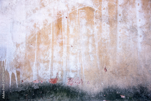 Abstract concrete, weathered with cracks and scratches. Remains of paint different colors on wall. Landscape style. Grunge Concrete Surface. Great background or texture.