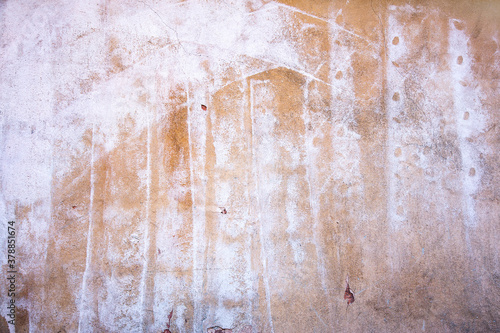 Abstract concrete, weathered with cracks and scratches. Remains of paint different colors on wall. Landscape style. Grunge Concrete Surface. Great background or texture.