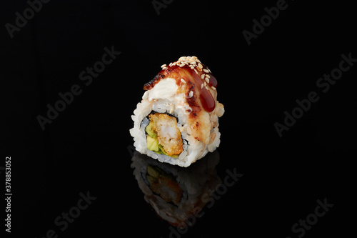 Roru - salmon, cucumber, cream cheese, tamago, tobiko, wasabi on a black background