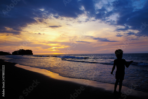 Boy fishing on the beach