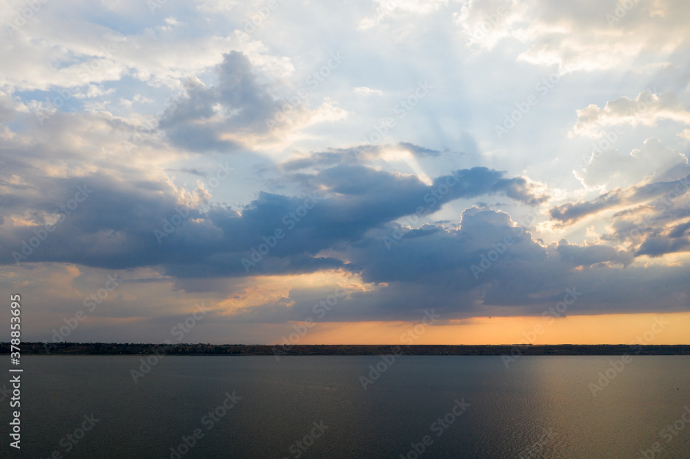 Obraz premium Beautiful twilight silhouette sunset on the Kuyalnik estuary near Odessa. Sunset over the lake. Evening sky with colorful cloud on twilight, Dusk