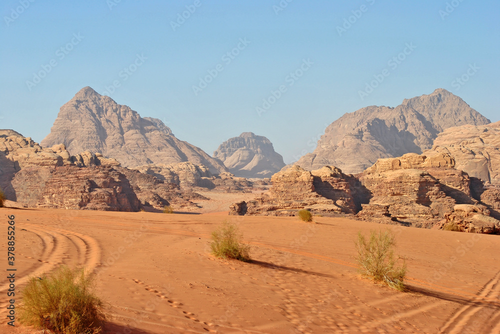 Landscape of Wadi Rum desert. Rocks and footprints on the sand.