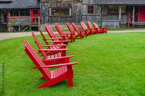 Sagamore Lake, NY: A row of Adirondacks chairs on the lawn at the Great Camp Sagamore, built in 1897.