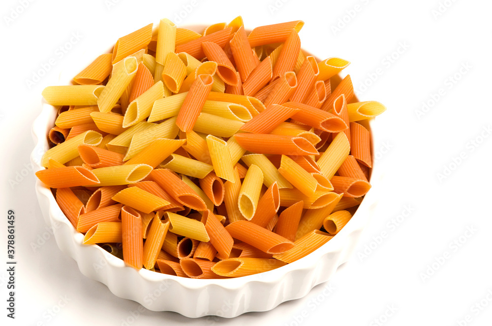 Close-up of raw penne pasta in a bowl Close-up of raw penne pasta in a bowl