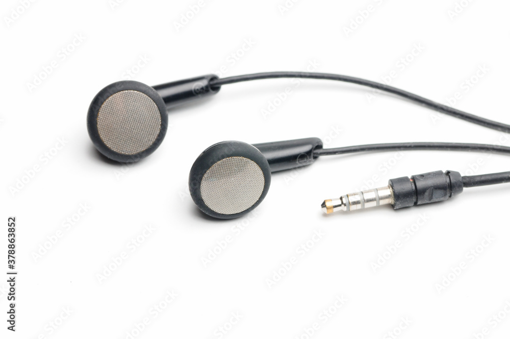 Earphone for music player and smartphone on white background Earphone for music player and smartphone on white background