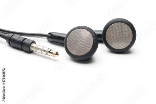Earphone for music player and smartphone on white background