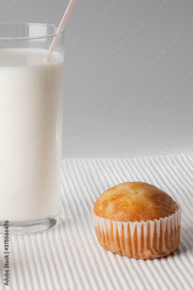 Close-up of a glass of milk and a cupcake Close-up of a glass of milk and a cupcake