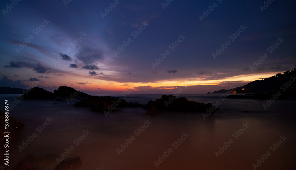Amazing Beautiful Light of nature Dramatic sky seascape with rock in the foreground in sunset or sunrise scenery background.