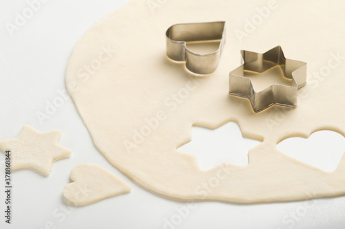 Two pastry cutters on dough photo