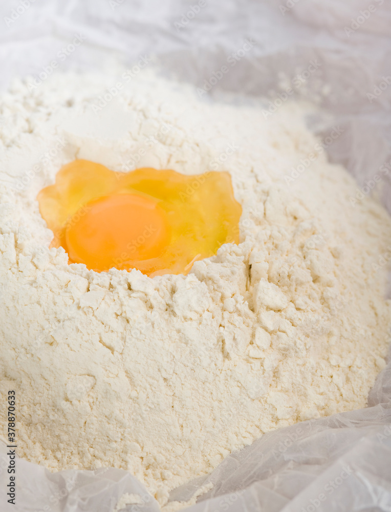 Close-up of egg yolk with flour Close-up of egg yolk with flour