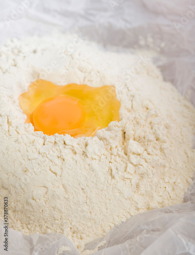 Close-up of egg yolk with flour