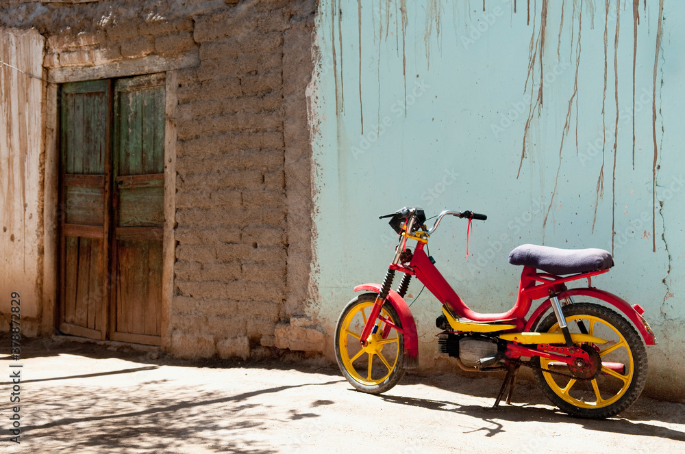 Moped parked against wall, La Rioja Province, Argentina