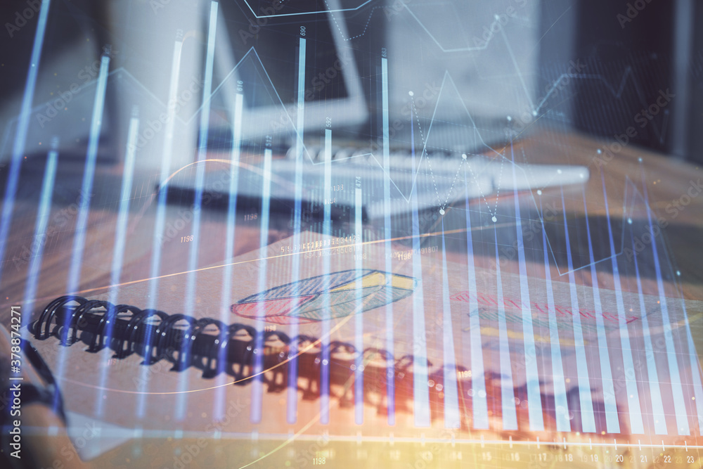 Double exposure of financial graph drawings and desk with open notebook background. Concept of forex market Double exposure of financial graph drawings and desk with open notebook background. Concept of forex market