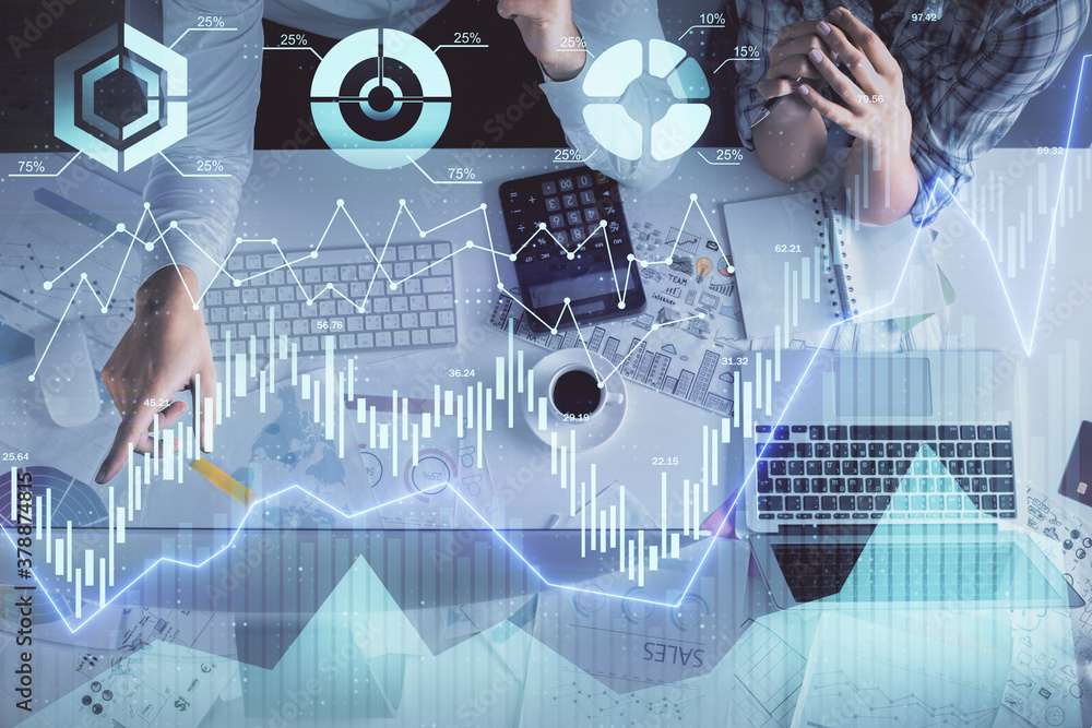 Double exposure of man and woman working together and financial graph hologram drawing. market analysis concept. Computer background. Top View.