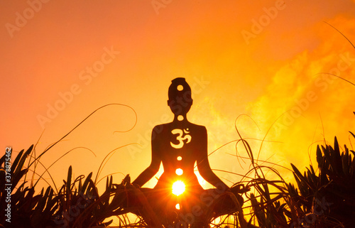 yoga position silhouette in contrasting sun, Sacral chakra
