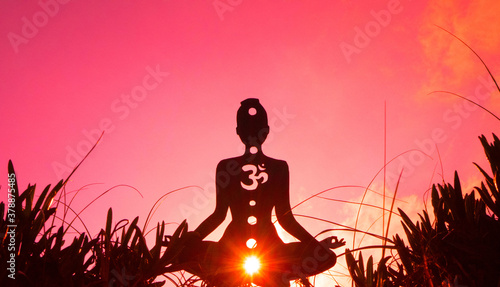 Photography yoga position silhouette in contrasting sun, Root Chakra