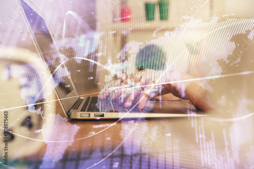 Double exposure of woman hands typing on computer and forex chart hologram drawing. Stock market invest concept.