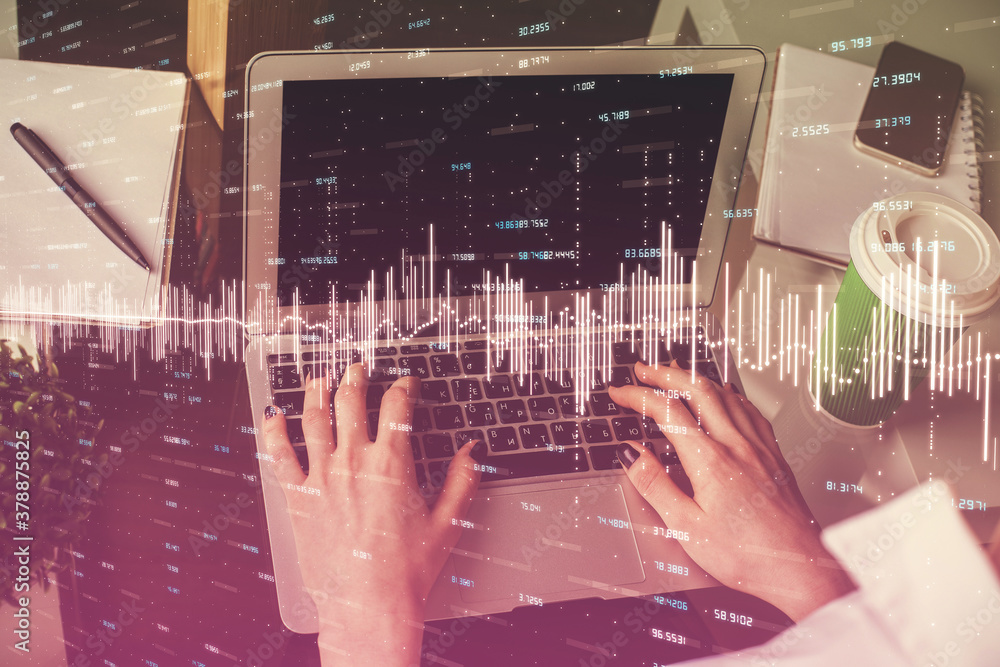 Double exposure of woman hands typing on computer and forex chart hologram drawing. Stock market invest concept.