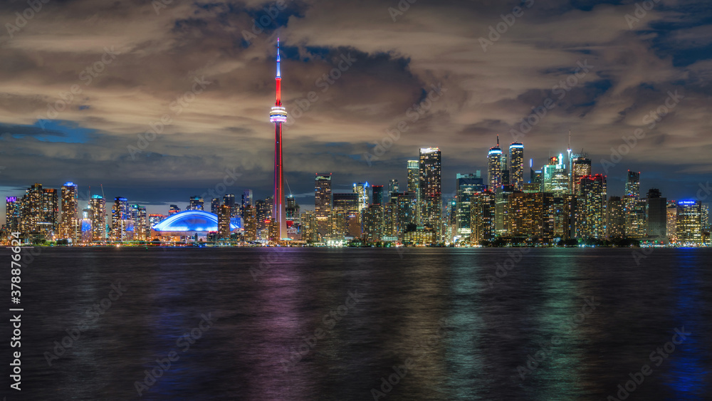 Night view of Toronto skyline and Lake Ontario in Toronto, Ontario, Canada.
