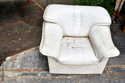 Closeup of Dirty Old sofas left on the side of the road, Selective Focus.