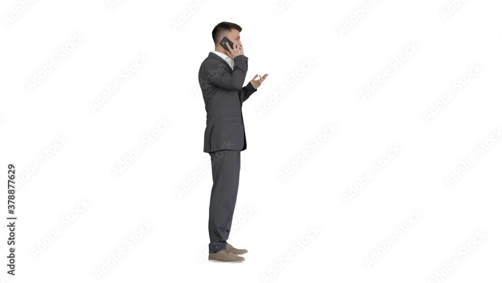 Business man in a suit talking with mobile phone on white background. Business man in a suit talking with mobile phone on white background.