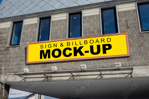 Mock up horizontal outdoors billboard on panel of building