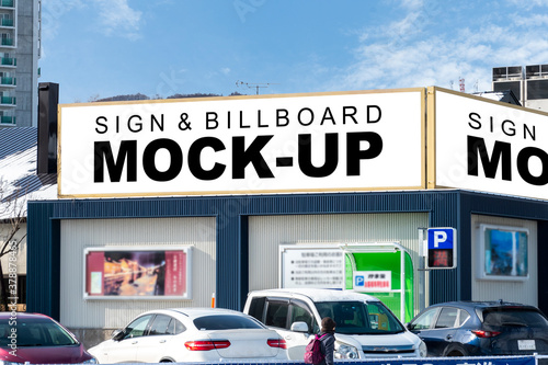Mock up large horizontal billboard on the roof of building
