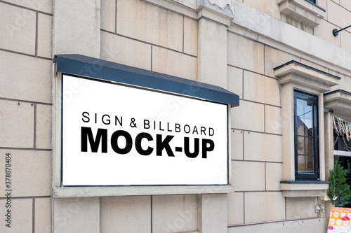 Mock up blank outdoor billboard on wall of building