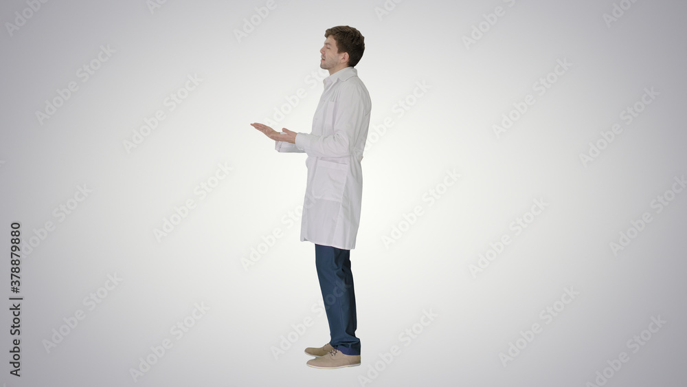 Doctor wearing white coat explaining something on gradient backg Doctor wearing white coat explaining something on gradient backg