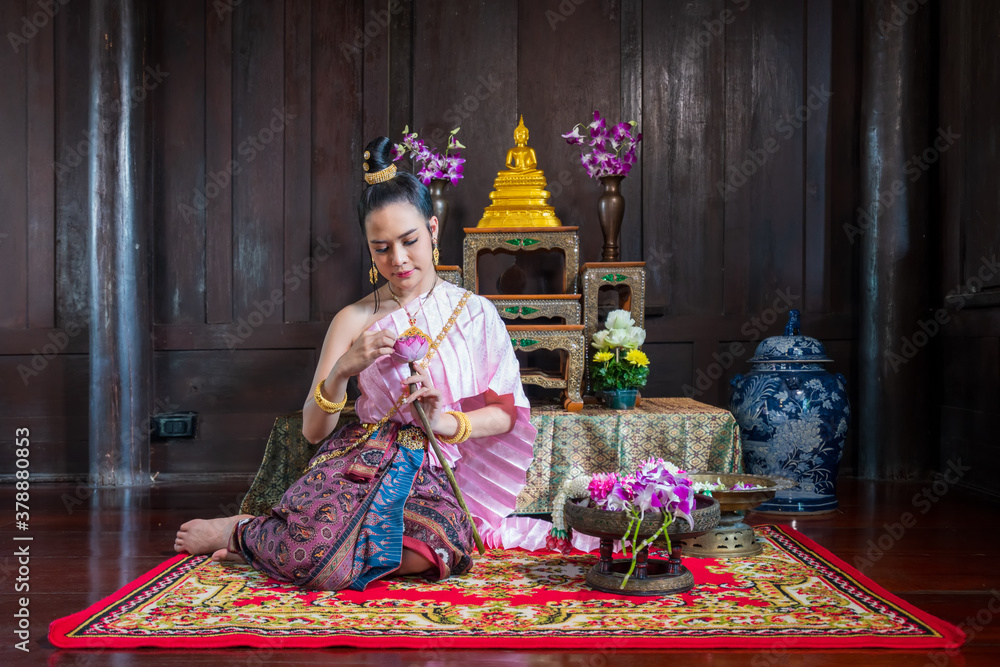 Fototapeta premium woman holding pink lotus