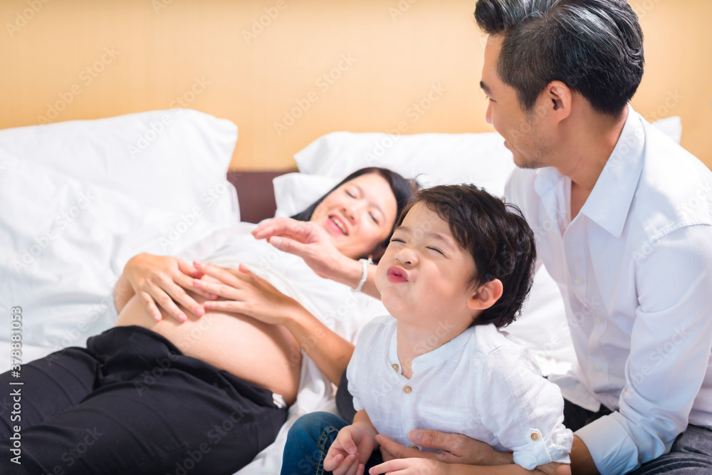 Candid shot Cute little boy relaxing with family stay at home. Candid shot Cute little boy relaxing with family stay at home.