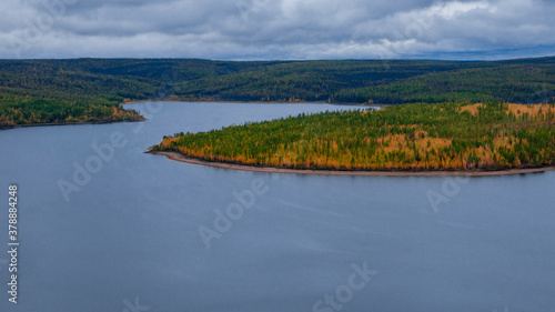 Autumn nature on the banks of the Viluy river in cloudy weather. photo