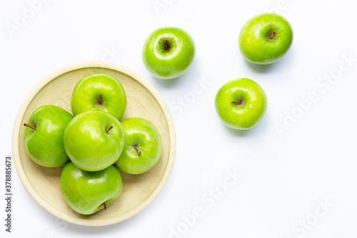 Foto Green apples on white background. Copy space