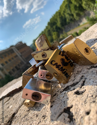 Photography Close up view of love padlocks on Pons Fabricius bridge at Tiber Island in Rome,
