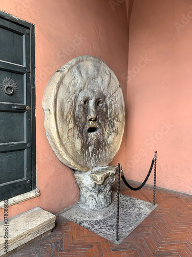 The famous sculpture Bocca della Verità of the church of Santa Maria - The mouth of truth, carved from Pavonazzo marble in Rome, Italy