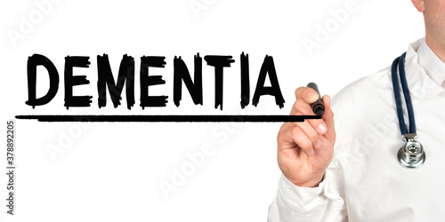 Doctor writes the word - DEMENTIA. Image of a hand holding a marker isolated on a white background.