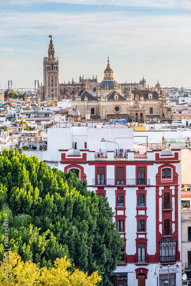 Fototapeta premium Seville, Spain. October 15th, 2019. View from Metropol Parasol on the hauses roofs and further on the Church of the Divino Salvador.