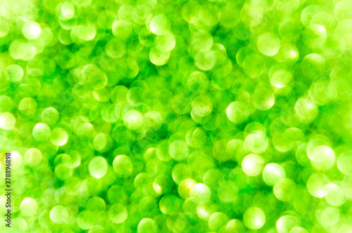 green abstract bokeh background, creative design. holiday decoration.