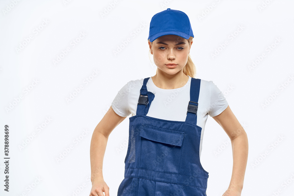 Woman in working uniform blue cap delivery courier delivery service Woman in working uniform blue cap delivery courier delivery service