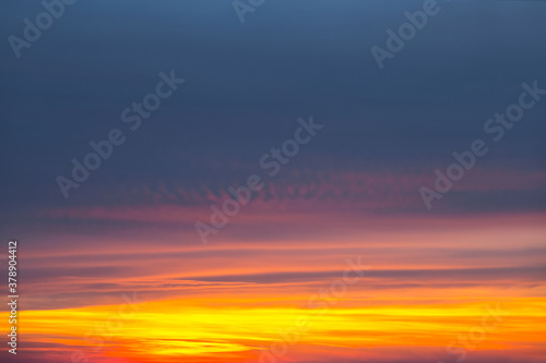 dramatic sunset over a cloudy sky, evening sky background © Yuriy Kulik