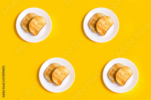 yellow background with food, toast on a plate