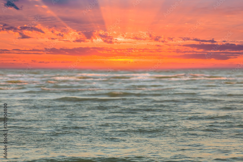 Fototapeta premium emerald sea at the red dramatic sunset