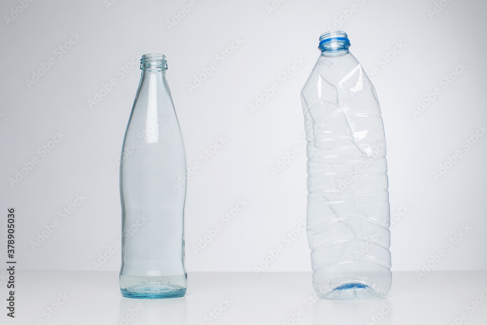 Glass bottle vs. plastic bottles, recycling concept Stock Photo Adobe Stock