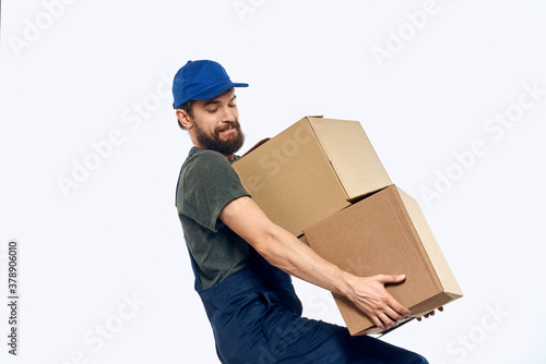 Working man with boxes in hands delivery service work lifestyle © SHOTPRIME STUDIO