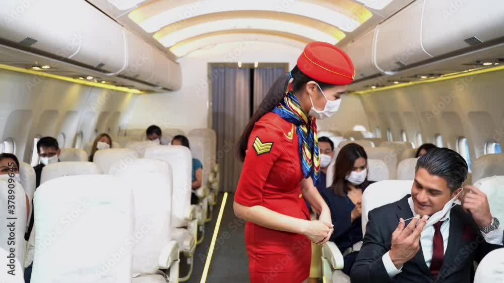 women with face mask flight attendant or cabin crew is walking and